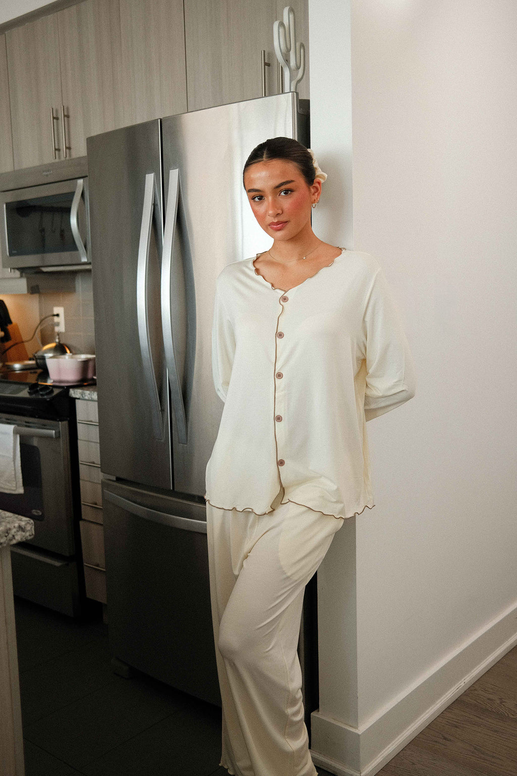 Ruffle Trim Pajama Set in Cream, on model, standing in the kitchen