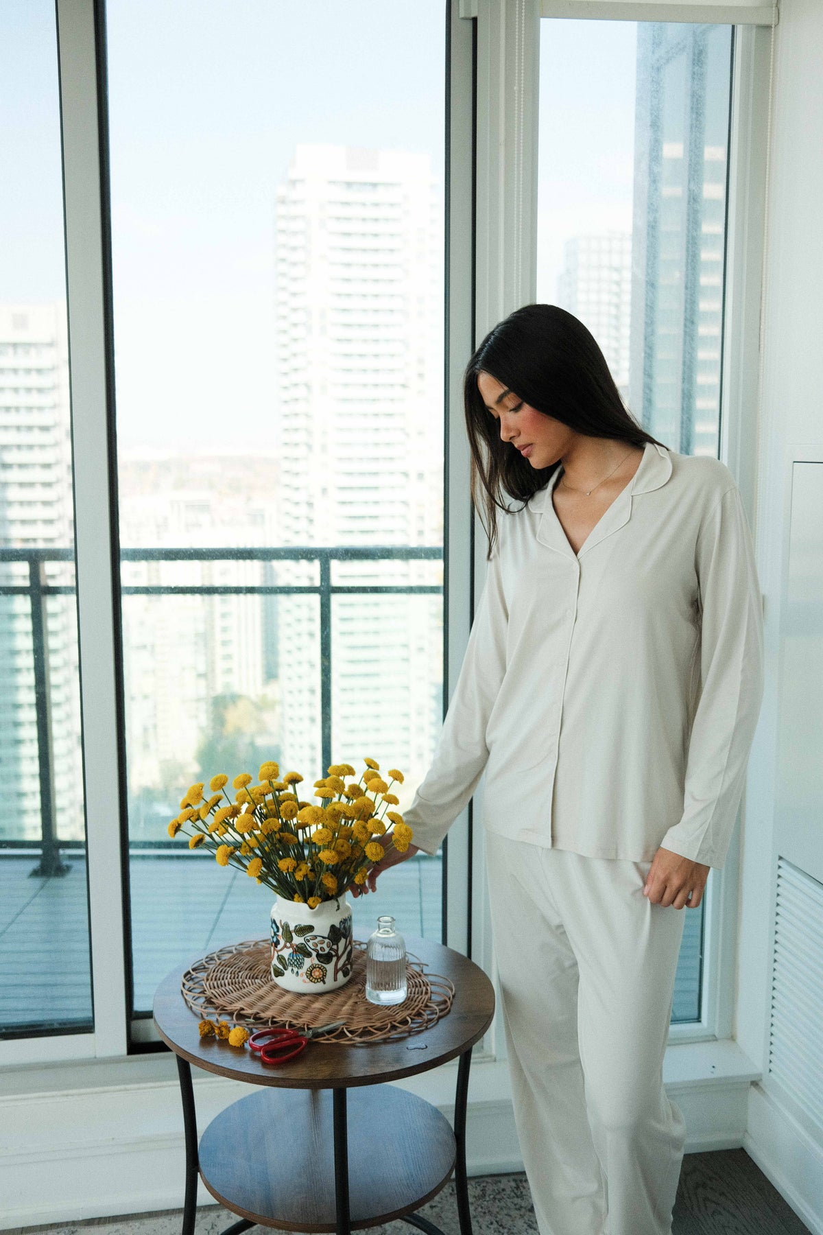 Camp Collar Pajama Set in Oatmeal, on model, arranging flowers by the window