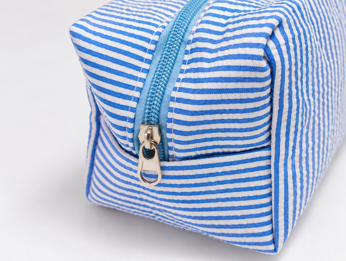 Seersucker Bow Makeup Bag in Blue Stripe, zip detail