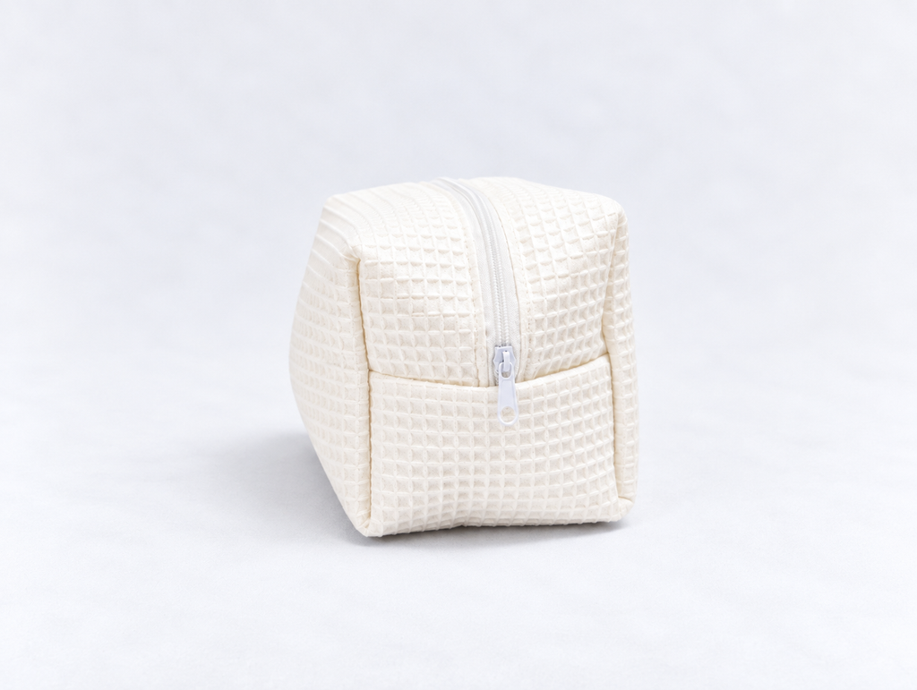 Padded Waffle Makeup Bag in Cream, side zip