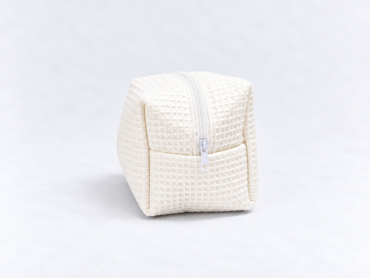Padded Waffle Makeup Bag in Cream, side zip