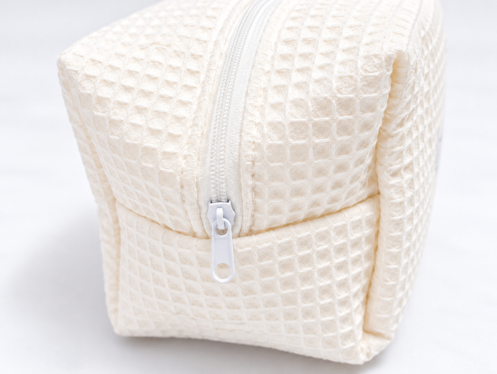 Padded Waffle Makeup Bag in Cream, zip detail