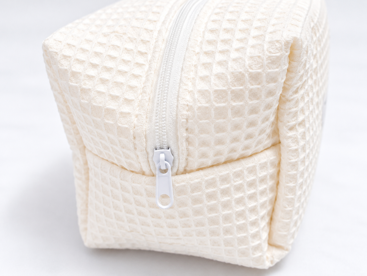 Padded Waffle Makeup Bag in Cream, zip detail