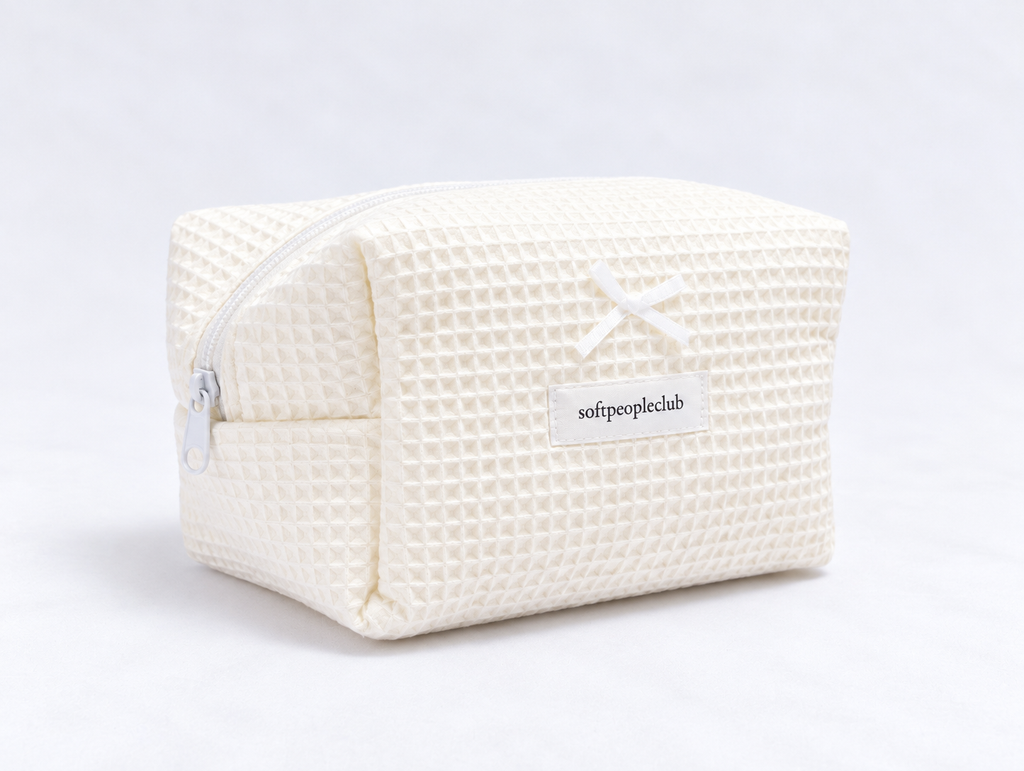 Padded Waffle Makeup Bag in Cream, angled view