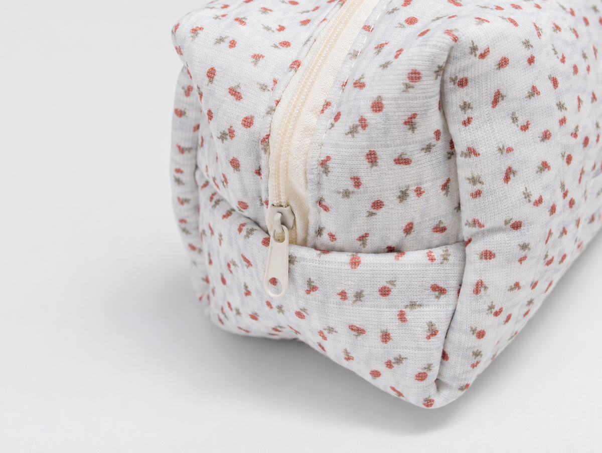 Padded Ditsy Floral Makeup Bag, zip pull detail