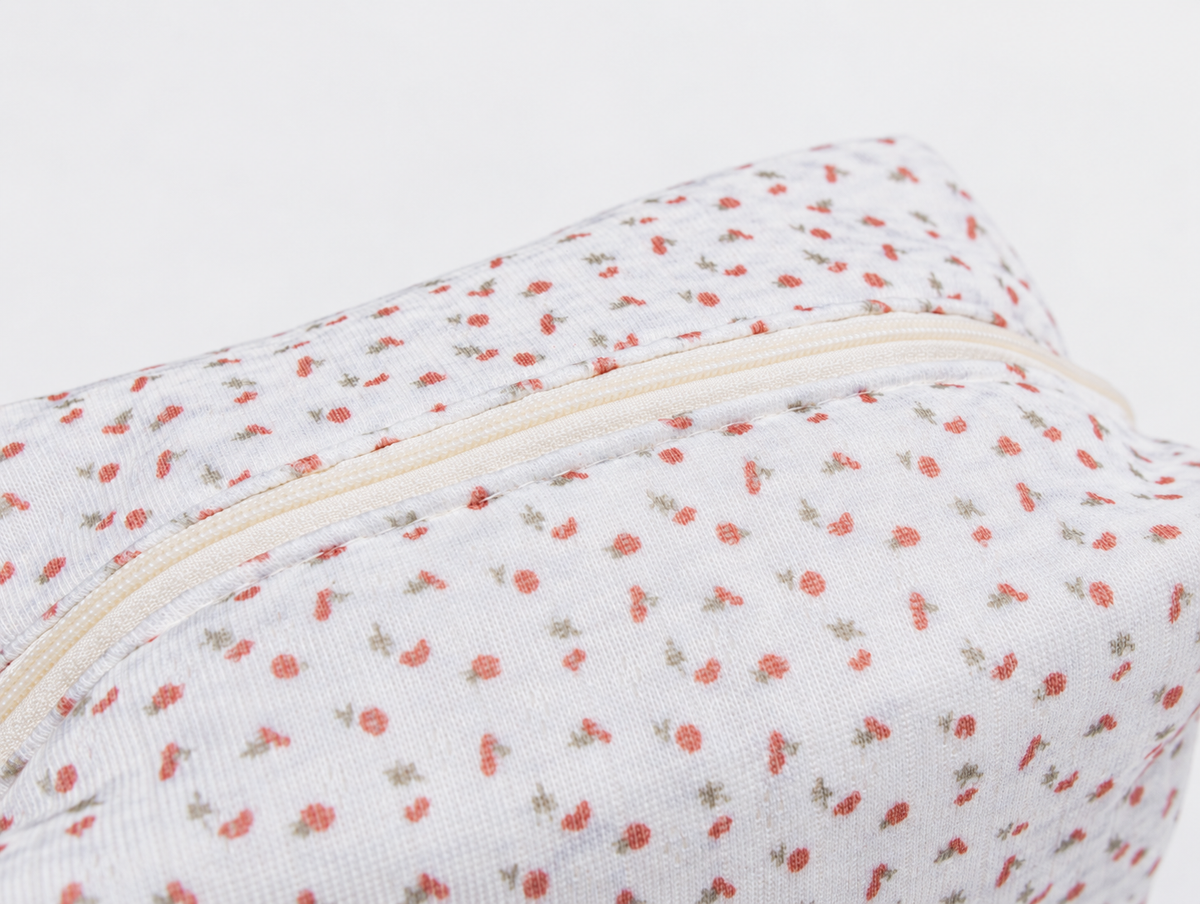 Padded Ditsy Floral Makeup Bag, top zip and print detail