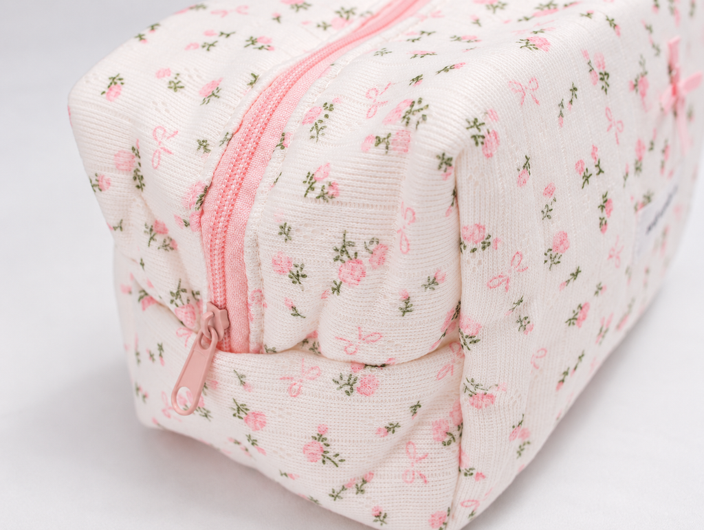 Padded Rose & Bow Makeup Bag, pink zip pull detail