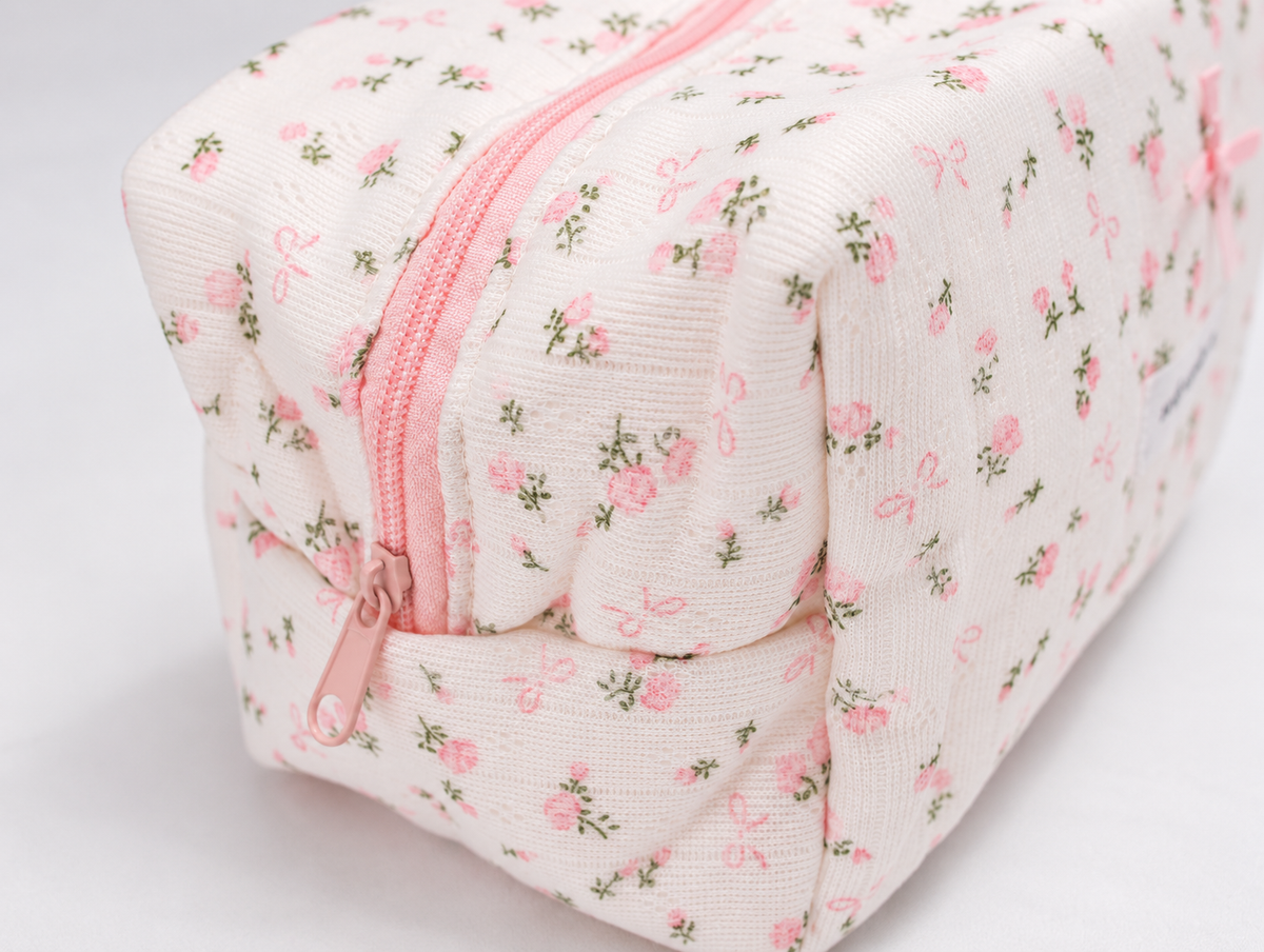 Padded Rose & Bow Makeup Bag, pink zip pull detail
