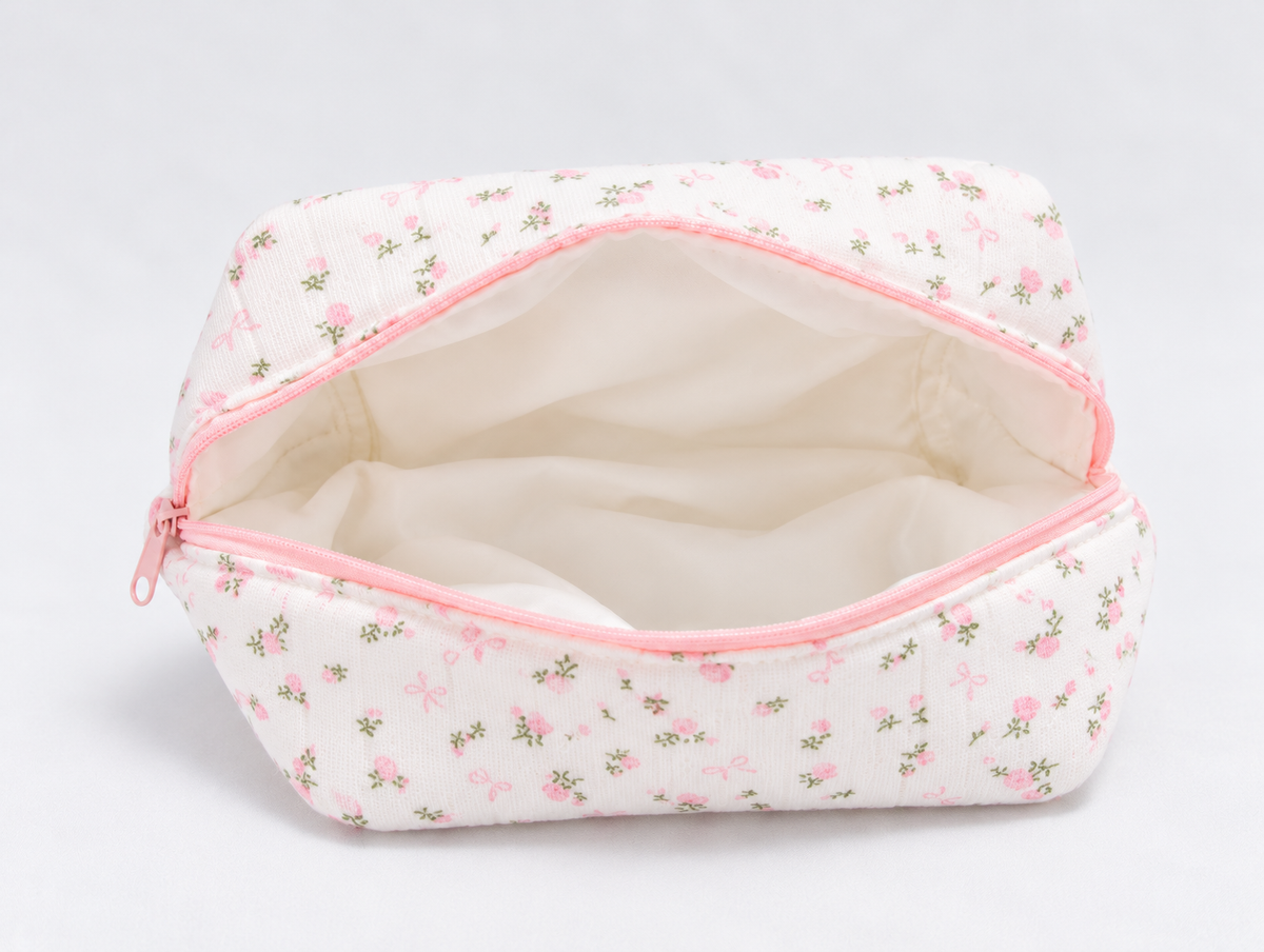 Padded Rose & Bow Makeup Bag, open with cream lining