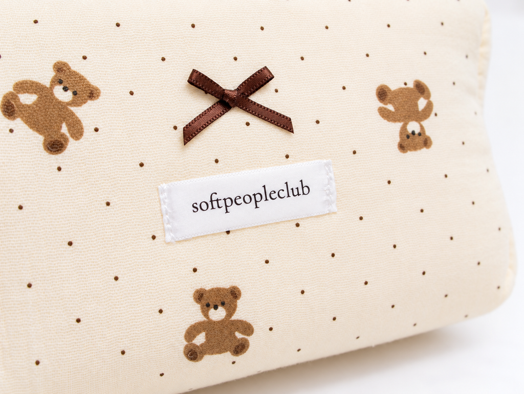 Padded Teddy Dot Makeup Bag, brown bow and label detail