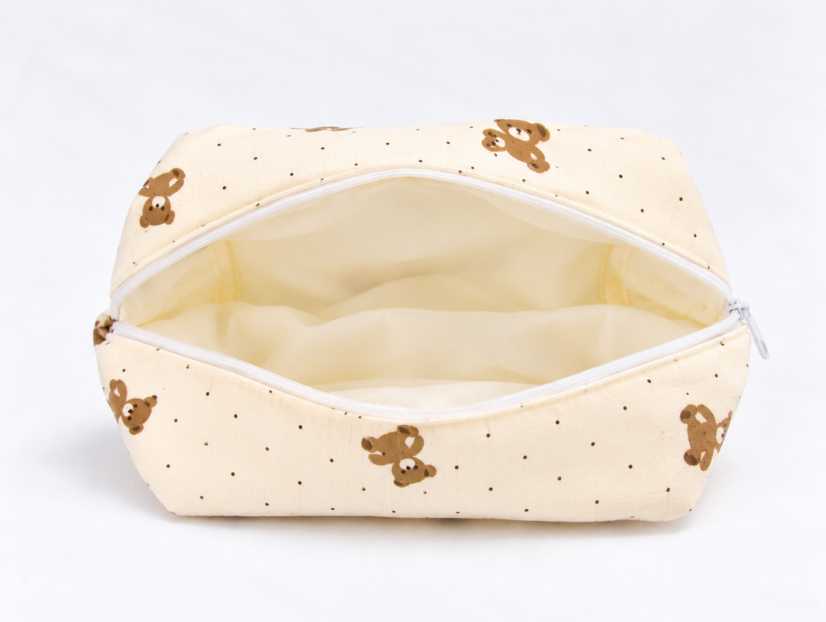 Padded Teddy Dot Makeup Bag, open with cream lining