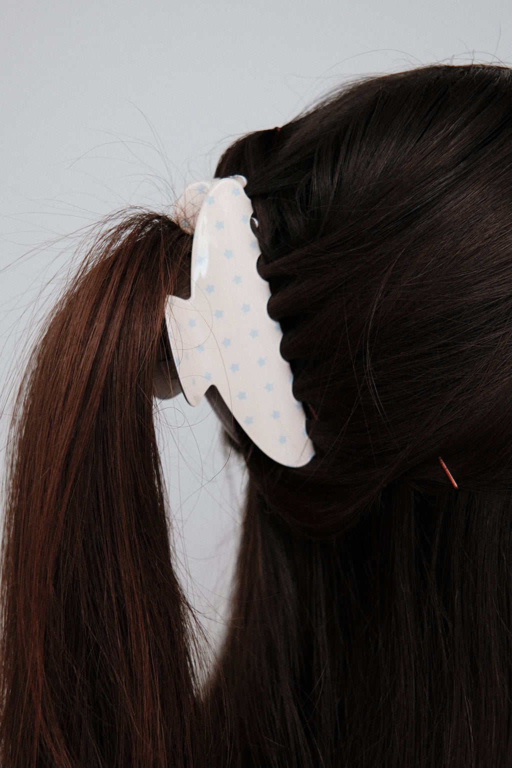 Little Star Claw Clip in Cream, worn in hair, close up