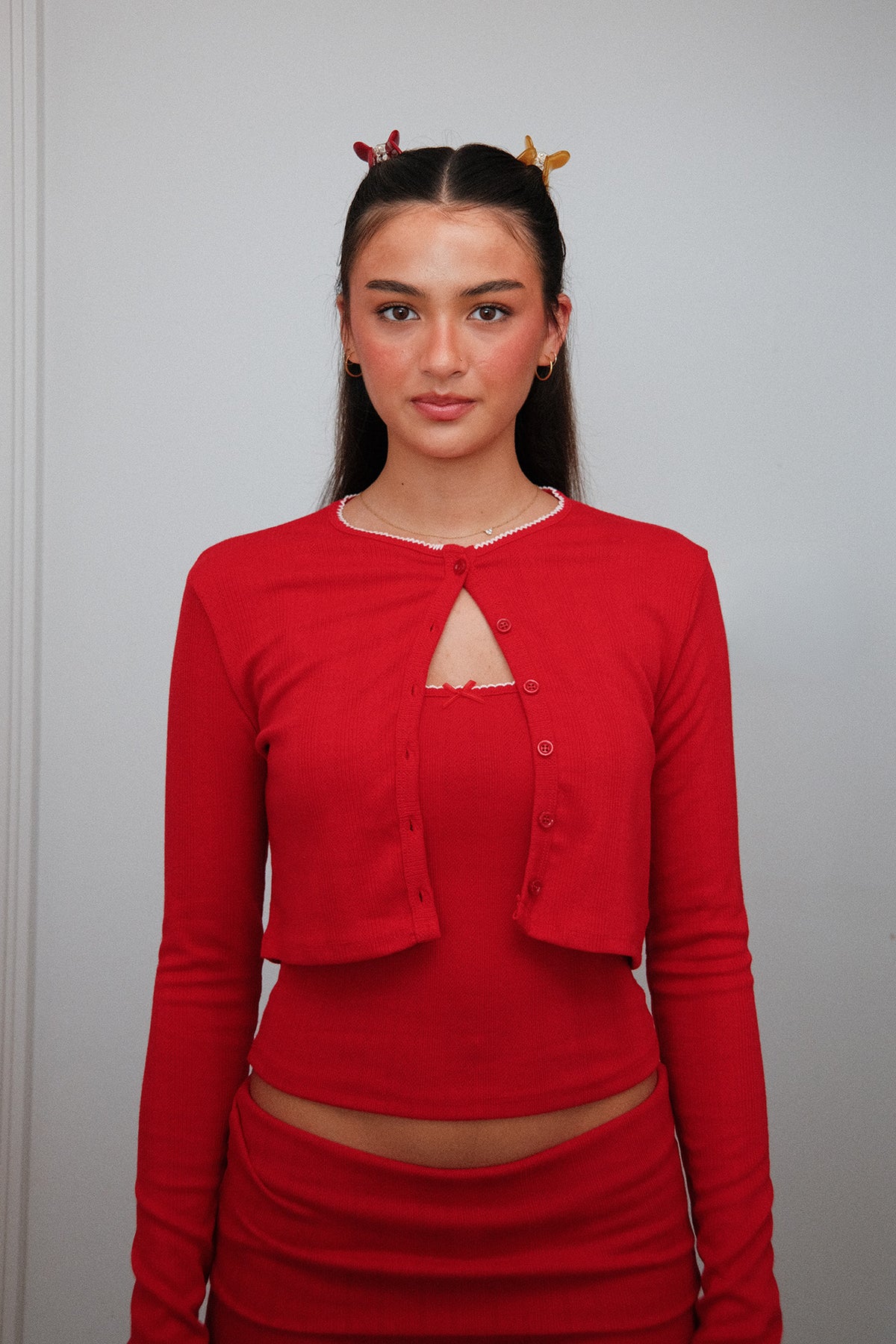 Mini Jelly Claw Clip in Yellow and Red, worn in hair, portrait